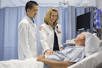 doctors looking at a patient