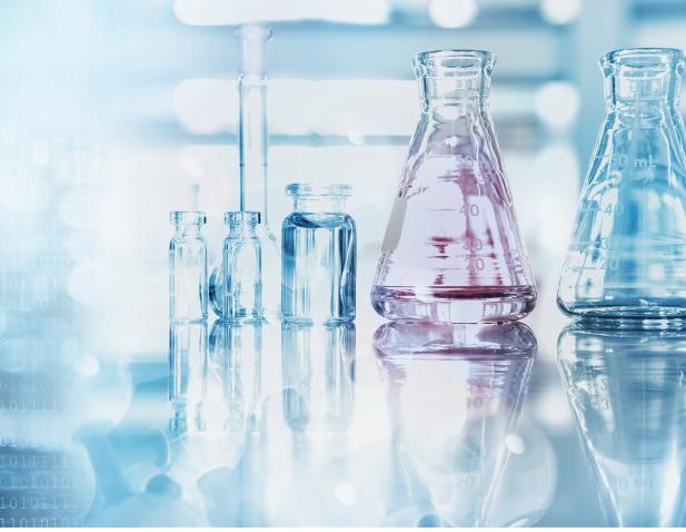 soft focus flask and beaker on lab bench