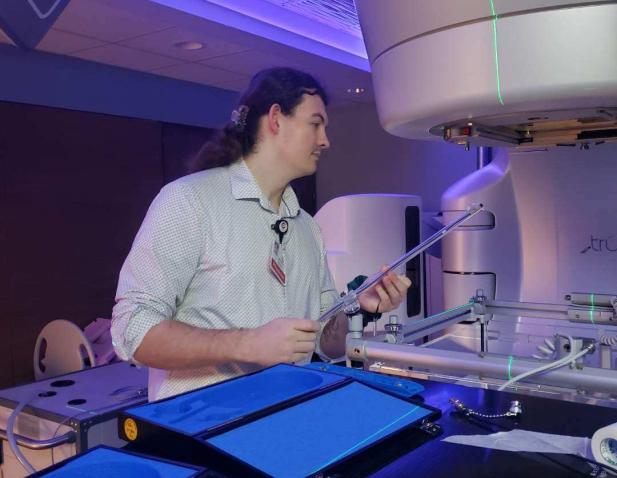 Medical physicist calibrating equipment 